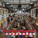 People enjoying Granville Island indoor activities during a rainy day in Vancouver