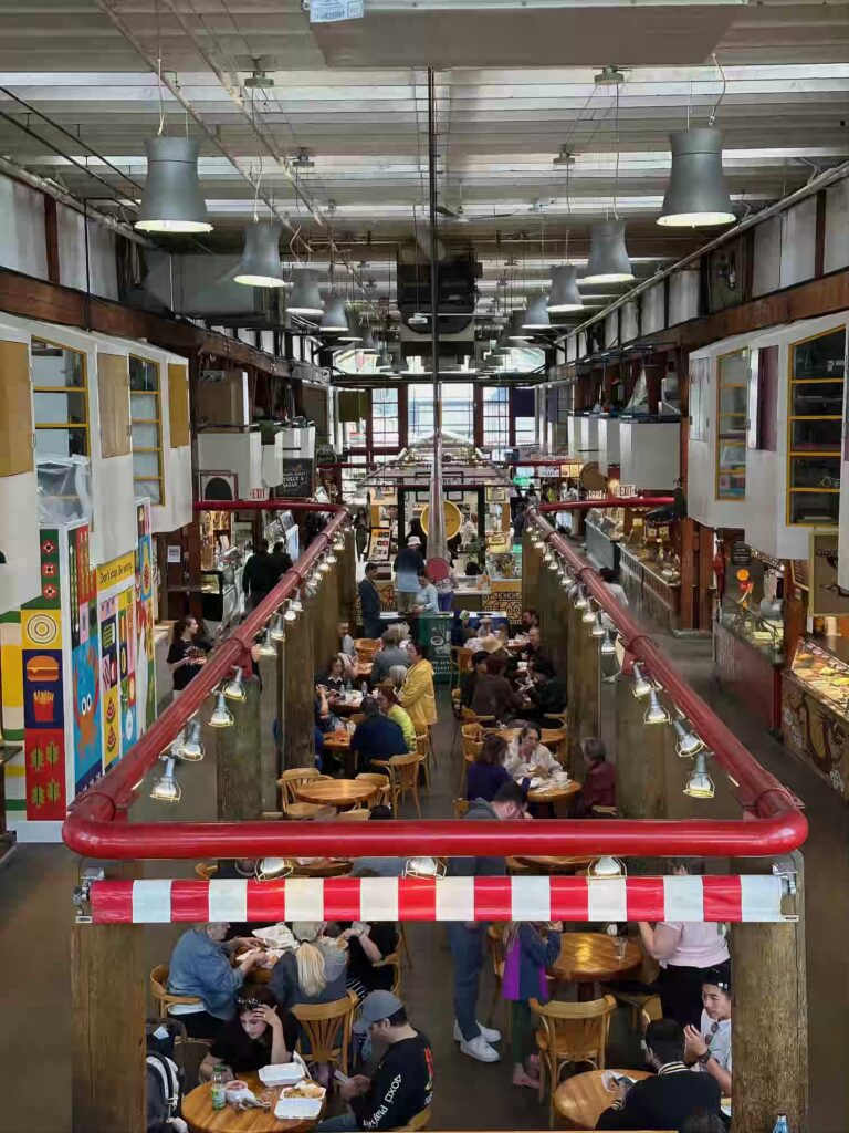 People enjoying Granville Island indoor activities during a rainy day in Vancouver