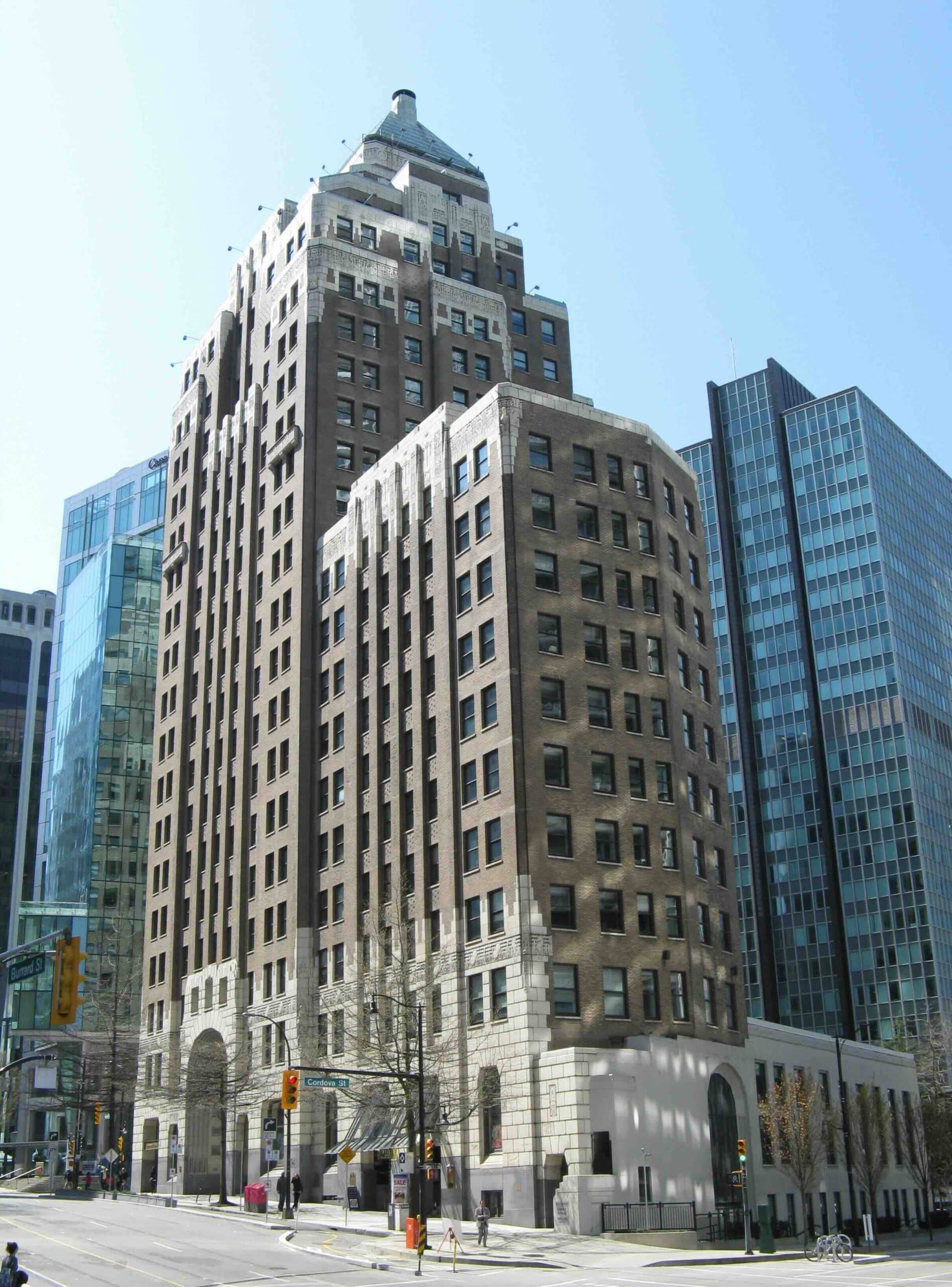 Marine Building in Vancouver in daylight, showing its stepped tower, brick facade and pale terra cotta details.
